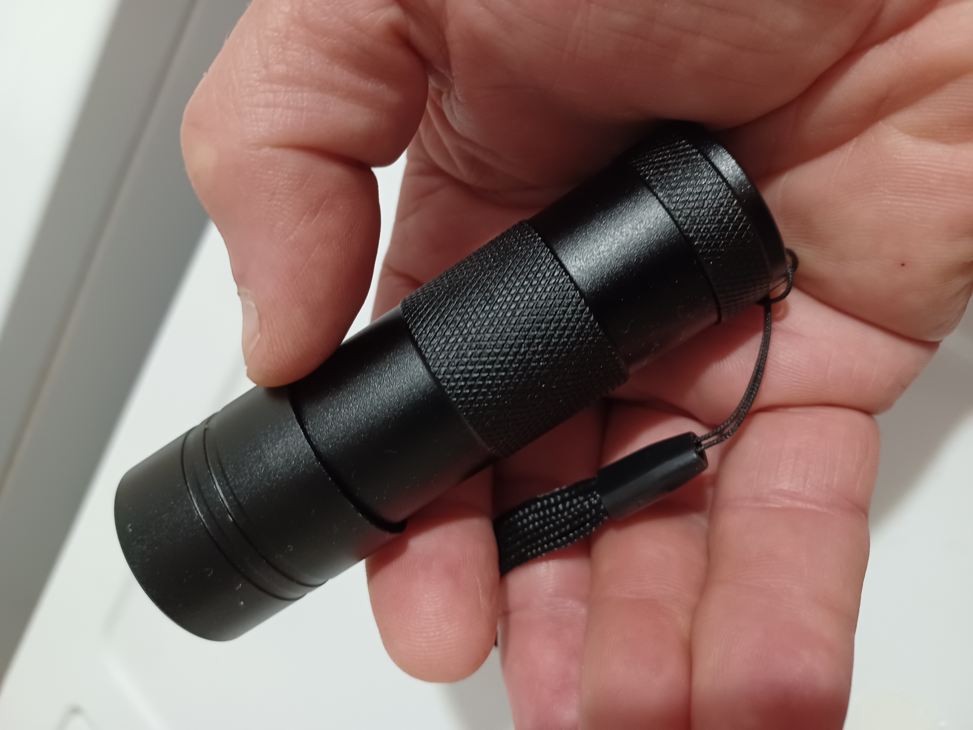 A small blacklight flashlight.